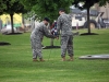 Command Sgt. Maj. Lyle Marsh, command sergeant major of the 5th Special Forces Group (Airborne), moves a memorial wreath into place during the annual 5th SFG(A) Memorial Ceremony on Gabriel Field, May 16, 2015, at Fort Campbell, Ky. (U.S. Army photo by Spc. Alexis Concepcion, 5th SFG(A) Combat Camera)