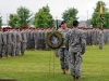 Col. John W. Brennan, the commander of the 5th Special Forces Group (Airborne), prepares to move a memorial wreath into place during the annual 5th SFG(A) Memorial Ceremony on Gabriel Field, May 16, 2015, at Fort Campbell, Ky. (U.S. Army photo by Sgt. Justin A. Moeller, 5th SFG(A) Public Affairs)