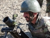 A soldier from the Afghan National Army, 1st Brigade, 203rd Corps, begins to calibrate the sights on his 82mm mortar system during a live-fire exercise that marked the conclusion of a two-week mortarmen course at the Fires Center of Excellence, Camp Parsa, Afghanistan, Jan. 3, 2013. Once they have completed the required training, the trainees must exhibit their abilities to successfully employ and utilize their weapon system. (U.S. Army photo by 1st Lt. Bryan Spear, 3-320th FA, Unit Public Affairs Representative)