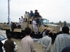 Grateful Afghan villagers are rescued from flash floods by Afghan National Army Soldiers July 28th. The ANA Soldiers rescued over 200 villagers from flash flooding in the Beshood District of eastern Afghanistan’s Nangarhar province.  (Courtesy of the U.S. Army)