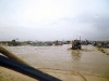 JALALABAD, Afghanistan – International Security Assistance Forces drive through several inches of water here July 28th after rain flooded areas outside of Forward Operating Base Fenty. ISAF went out to conduct assessments of and provide aide to the flooded areas here after more than six inches of rain fell.  (Courtesy of the U.S. Army)