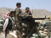 Afghan National Army Soldiers from 1st Kandak, 4th Brigade, 201st Corps, look out for enemy activity from a watch tower outside the village of Hesarak, Nangarhar Province, Afghanistan, May 15. The improved fighting position helped the ANA provide security in the area while other ANA soldiers conducted foot patrols throughout the village. (U.S. Army photo by Spc. Vang Seng Thao, 55th Signal Company, Combat Camera)