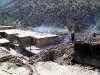 BARG-E MATAL, Afghanistan – A villager goes about reclaiming his property July 26th in the battle-damaged Barg-e Matal. Taliban forces were observed attempting to torch homes before the arrival of the Government of the Islamic Republic of Afghanistan forces. (Photo courtesy U.S. Army)