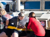 Members of Austin Peay State University softball team work together to pull military tactical vehicles across a parking lot in a head-to-head competition at 5th Special Forces Group (Airborne), Fort Campbell, Ky., Friday, Oct. 18, 2019. These events were designed to develop soldier like teamwork within the team. (Sgt. Christopher Roberts)