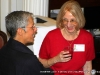 Ellen Kanervo speaking with a attendee.