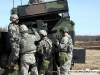 Soldiers reading their weapon
