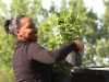 Sgt. Arielle Cushionberry, the noncommissioned officer-in-charge of Blanchfield Army Community Hospital's clinical nutrition section, unloads plants May 23, 2014 at Fort Campbell for the Army's first healing garden located within a medical facility's footprint. (U.S. Army photo by Stacy Rzepka/RELEASED)