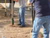 From left to right, Lt. Col. Brian Jovag, chief of physical therapy at Blanchfield Army Community Hospital, Sgt. Matthew Ellis with 3rd Brigade Combat Team and Jerry Weaver, the spouse of a BACH employee, all dig post holes for the Fort Campbell hospital's new on-site therapeutic garden May 23, 2014. (U.S. Army photo by Stacy Rzepka/RELEASED)