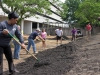 A team of volunteers create the Army's first healing garden located within a medical facility's footprint at Blanchfield Army Community Hospital May 23, 2014. More than 20 BACH staff members and local community members came together to build the garden, which will be used as therapy for wounded, injured and ill Soldiers while providing organic fruit and vegetables for the hospital's dining facility. (U.S. Army photo by Stacy Rzepka/RELEASED)