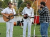 Nick Vandenberg, Geoff Goodhue, and a new friend, playing music for the gathering crowd