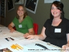 Rachael and Whitney sign people up for the Midsouth Flute Festival