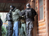 Members of ‘Strike Team 2’, made of the 163rd Military Police Department Special Reaction Team, the Montgomery County Sherriff’s Office Emergency Services Unit and the Clarksville Police Department apprehend a pretend suspect during an interagency training operation Nov. 27, at the Public Safety Training Center in Clarksville, Tennessee.  (Pfc. Lynnwood Thomas, 40th Public Affairs Detachment)