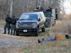 A pretend suspect waits to for ‘Strike Team 3’ to apprehend him during an interagency training operation Nov. 27, at the Public Safety Training Center in Clarksville, Tennessee. The training included members of the 163rd Military Police Department Special Reaction Team, the Montgomery County Sherriff’s Office Emergency Services Unit and the Clarksville Police Department.  (Pfc. Lynnwood Thomas, 40th Public Affairs Detachment)