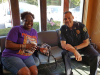 Clarksville Police Department visit with people at Keesee Barbershop during their third "Chat and a Cut" community outreach event.