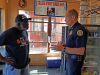 Clarksville Police Department visit with people at Keesee Barbershop during their third "Chat and a Cut" community outreach event.