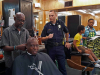 Clarksville Police Department visit with people at Keesee Barbershop during their third "Chat and a Cut" community outreach event.