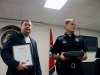 Lt Dale Ward receives his certificate and service weapon from Chief Al Ansley and receives a knife engraved with his name from the District 3 Criminal Investigations Unit.