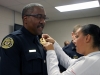 Lt Vincent Lewis receives his Lieutenant Badge was pinned on by his daughter, Tabitha Lewis