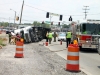 Tractor Trail flips on it\'s side while making a left turn from Hwy 48/13 onto Riverside Drive. (Photo by CPD Jim Knoll)