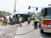 Tractor Trail flips on it\'s side while making a left turn from Hwy 48/13 onto Riverside Drive. (Photo by CPD Jim Knoll)