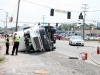 Tractor Trail flips on it\'s side while making a left turn from Hwy 48/13 onto Riverside Drive. (Photo by CPD Jim Knoll)