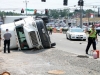 Tractor Trail flips on it\'s side while making a left turn from Hwy 48/13 onto Riverside Drive. (Photo by CPD Jim Knoll)