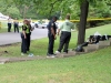 Clarksville Police Officers examine the area where a Yamaha Motorcycle crashed killing the rider. (Photo by Jim Knoll-CPD)