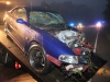 The Ford Mustang after it was pulled out of the embankment and loaded onto a tow truck. (Photo by CPD-Jim Knoll)