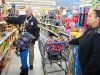 Officer Booker Dailey helping a young shopper. (Photo by CPD-Jim Knoll)