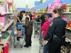An Explorer and Reserve Officer Lori Kryszewski with shoppers. (Photo by CPD-Jim Knoll)