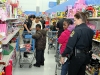 An Explorer and Reserve Officer Lori Kryszewski with shoppers. (Photo by CPD-Jim Knoll)