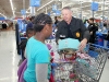 Captain Craig Gipson placing one of the presents in a basket. (Photo by CPD-Jim Knoll)