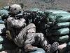 U.S. Army Sgt. Diamond I. Salsedo of Honolulu, a squad leader with 4th Platoon, Company D, 1st Battalion, 327th Infantry Regiment, Task Force Bulldog, uses his rifle scope to search the hillside during a more than three-hour firefight at the Shege East Afghan National Police checkpoint Sept. 18th. (Photo by U.S. Army Staff Sgt. Gary A. Witte, 300th Mobile Public Affairs Detachment)