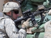 U.S. Army 2nd Lt. Joseph B. Pitt of Atlanta, platoon leader for 4th Platoon, Company D, 1st Battalion, 327th Infantry Regiment, Task Force Bulldog, directs his men to shoot at enemy positions on a nearby hillside during a more than three-hour firefight at the Shege East Afghan National Police checkpoint Sept. 18th. (Photo by U.S. Army Staff Sgt. Gary A. Witte, 300th Mobile Public Affairs Detachment)