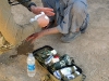 A Lithuanian special operation forces’ medic cleans a wound on an Afghan boy’s hand October 1st during a humanitarian assistance visit. Task Force Wings, 4th Battalion, 101st Aviation Regiment; along with TF 77, conducted a humanitarian assistance visit and key leader engagement at the Bolla Baba High School.  (Photo by Staff Sgt. Joshua Dewitt)