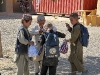 A group of Afghan boys sift through the school supplies they received during a humanitarian assistance visit at their school October 1st. Task Force Wings (4th Battalion, 101st Aviation Regiment), along with TF 77, conducted a humanitarian assistance visit and key leader engagement at the Bolla Baba High School, (U.S. Army Photo by Staff Sgt. Joshua Dewitt, Task Force Wings Fire Support Officer /released) 