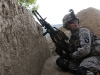 U.S. Army Pfc. Edwin O. Crespo of Puerto Rico, a gunner with 1st Platoon, Company A, 1st Battalion, 327th Infantry Regiment, Task Force Bulldog, provides security for his platoon outside the village of Angla Kala in eastern Afghanistan’s Kunar Province the morning of Sept. 16th. (Photo by U.S. Army Staff Sgt. Gary A. Witte, 300th Mobile Public Affairs Detachment)