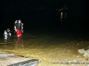 The Montgomery County Rescue Squad divers surface after the submerged car is hooked to the tow cable.