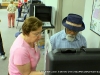 A poll worker explains the voting process to a ex-military voter.