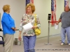 A happy local woman moves up when her turn to vote comes.