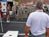 Sgt. Jimmy Brown watches as members of the National Guard attempt to land a beanbag in a hole while wearing goggles that simulate intoxication.