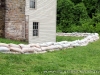 A line of sandbags protecting the base of the Surrender House / Dover Hotel.