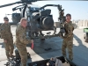 Sgt. Lee Denhe (right) and Pfc. Keith Recore (left), D Company, 1st Battalion, 101st Combat Aviation Brigade avionics and weapons systems technicians, take a sighting kit off of an AH-64D Apache helicopter after conducting maintenance at Forward Operating Base Salerno, Afghanistan, Jan. 23, 2013. (U.S. Army photo by Sgt. Duncan Brennan, 101st CAB public affairs)