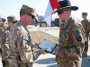 Pfc. Nathan Skeen, A Troop, 2nd Squadron, 17th Cavalry Regiment receives an Army Commendation Medal and an Army Achievement Medal from Lt. Col. Bill Ryan, commander, 1st Battalion, 101st Combat Aviation Brigade, Task Force No Mercy during an awards ceremony on the flightline at Forward Operating Base Salerno, Afghanistan, Jan. 23, 2013. (U.S. Army photo by Sgt. Duncan Brennan, 101st CAB public affairs)