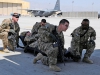 Task Force Lifeliner medics prepare to lift a litter during aeromedical evacuation training with the U.S. Air Force, Aug. 22, 2013 at Bagram Air Field, Parwan province, Afghanistan. During this training the soldiers learn how to safely load and unload patients on and off of a C-130 Hercules aircraft. (U.S. Army photo by Sgt. Sinthia Rosario, Task Force Lifeliner Public Affairs)