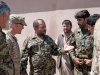 Afghan National Army soldiers and U.S. Army Soldiers with Security Forces Advisory and Assistance Team 6, 1st Brigade Combat Team, 101st Airborne Division, confer at former Combat Outpost Honaker-Miracle, Kunar Province, Afghanistan, July 4, 2013. (U.S. Army photo by Sgt. Margaret Taylor, 129th Mobile Public Affairs Detachment)