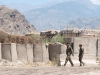 Afghan National Army soldiers walk down the road at former Combat Outpost Honaker-Miracle, Kunar Province, Afghanistan, July 4, 2013. U.S. Army Soldiers with Security Forces Advisory and Assistance Team 6, 1st Brigade Combat Team, 101st Airborne Division, have been conducting level-two advisory missions at Honaker-Miracle to help the ANA stationed there take a more dominant role in the region. (U.S. Army photo by Sgt. Margaret Taylor, 129th Mobile Public Affairs Detachment)