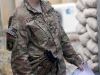 U.S. Army Capt. Samantha Reid, preventive medicine officer with Company C, 526th Brigade Support Battalion, 2nd Brigade Combat Team, 101st Airborne Division (Air Assault), prepares to set a bug trap for sample collection at Forward Operating Base Gamberi, Afghanistan, May 17, 2014. (U.S. Army photo by Sgt. David Cox, 2nd Brigade Combat Team Public Affairs)