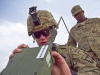 U.S. Army Spc. Christian Walker, a cavalry scout with 1st Squadron, 61st Cavalry Regiment, 4th Brigade Combat Team \"Currahee\", 101st Airborne Division (Air Assault), participating in the Soldier of the Quarter contest, puts a Single Channel Ground and Airborne Radio System, Advanced System Improvement Program, radio into operation at forward operating base Salerno, Afghanistan, July 14, 2013. (U.S. Army photo by Sgt. Justin A. Moeller, 4th Brigade Combat Team Public Affairs)