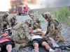 Soldiers from 2nd platoon, Whiskey Company, 2nd Battalion, 506th Infantry Regiment, attached to the 4th Brigade Special Troops Battalion, attend to simulated casualties at the casualty collection point during a mass casualty exercise on Forward Operating Base Salerno, Afghanistan, Aug. 6, 2013. (U.S. Army photo by Maj. Kamil Sztalkoper, 4th Brigade Public Affairs office)